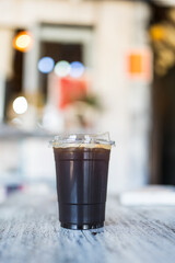 Refreshing iced black coffee or Americano in takeaway packaging