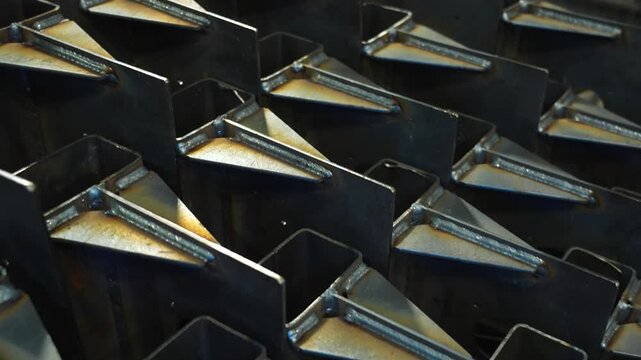 Welded steel profile structures stacked in factory with camera movement