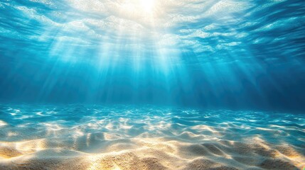 Fototapeta premium Sunlight streams through water to sandy ocean floor