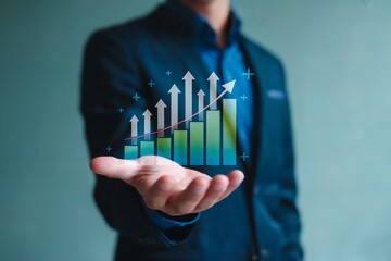 Business growth and financial success concept, visualized with an upward trending bar chart and arrows held in a persons hand