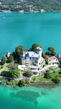 Aerial drone view of Ch&acirc;teau de Duingt on Lake Annecy, French Alps &ndash; 4K