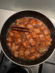 Braised pork belly in the pan.