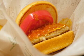 Japanese hamburger with Bolognese sauce and tomato.