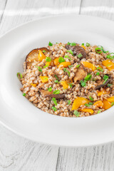 Buckwheat with Shiitake Mushrooms and Colorful Bell Peppers on White Plate