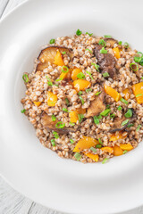 Buckwheat with Shiitake Mushrooms and Colorful Bell Peppers on White Plate