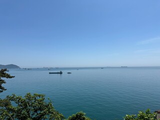 Ocean View with Ships Under Clear Sky