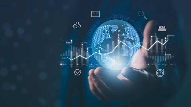 Global network and digital marketing data concept with businessman holding virtual globe and analytics chart, representing online business growth, big data insights, and worldwide digital strategy.
