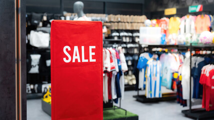 Sale discount promotion banner in front of the football sporting goods store. Sign and symbol for business marketing.