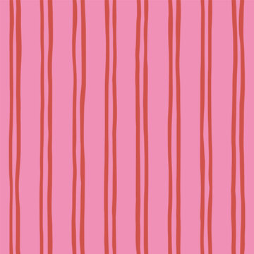 Seamless striped playful pattern with vertical red wavy lines on pink background. Hand drawn geometric abstract design for textile, wallpaper, wrapping paper, cover