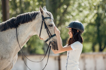 Girl Bonding with White Horse