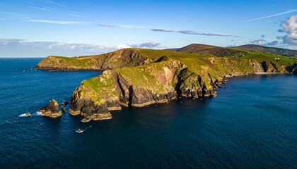 Fototapeta premium Dramatic Irish Coastline Aerial View with Rugged Cliffs and Deep Blue Ocean