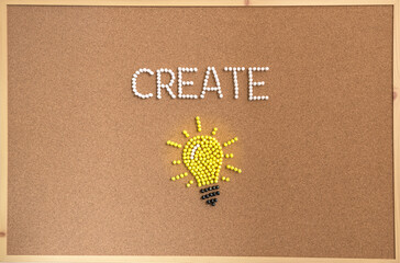 Minimal concept image of a glowing yellow lightbulb with the word CREATE beside it, symbolizing creativity, innovation, new ideas, inspiration, and imagination in a modern design.