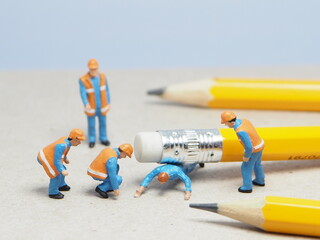 Mini toy of action figure with blurred background. Miniature photography concept design at office...