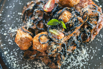 A pizza with mushrooms and cheese on top.