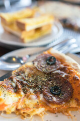 A pizza with mushrooms and cheese on top.