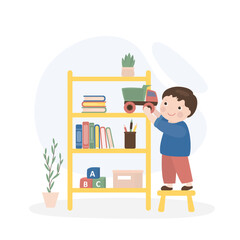 Happy child puts toys and books on the shelf. Cleaning the children's room. Little boy helps parents to clean and tidy the house. Fun and happy childhood.