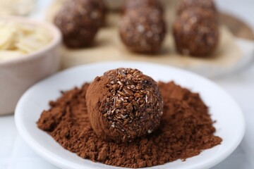 Making homemade candies. Chocolate balls and ingredients on table, closeup