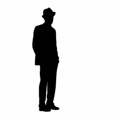 A man in a suit and hat standing with his hands by his sides