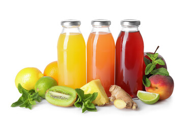 Tasty juices in glass bottles, fresh fruits, ginger and mint isolated on white