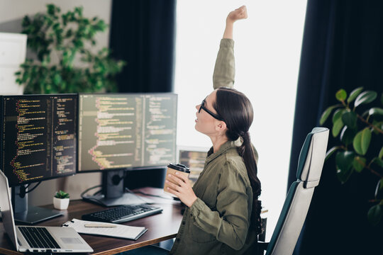 Young programmer stretching during remote work at home office, coding enthusiast with casual style and creative workspace - Powered by Adobe