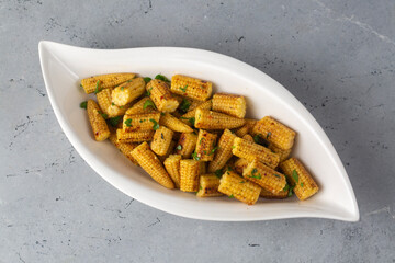 Fried  or grilled corn with various spices