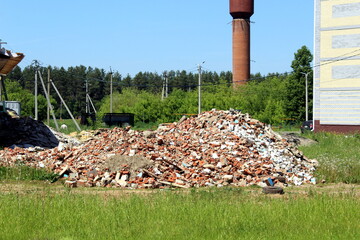 There is a pile of construction waste lying in the yard.