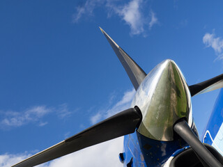 Propeller airplane engine and blade close-up against blue sky, aviation technology and transport detail. © ago