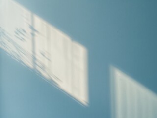 Shadows on a Blue Wall. Light and Architectural Details in an Interior Space.