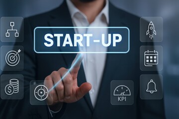 A businessperson interacts with a futuristic interface displaying the concept of startup, with icons representing organization, targets, finances, and key performance indicators.