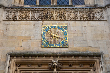 Cambridge, England. Close-up of the original 1679 clock face, blue and gilded hands, on the tower of Great St Mary's Church