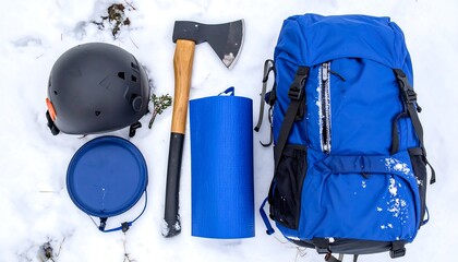 Winter Camping Gear Arrangement in Snow Flat Lay