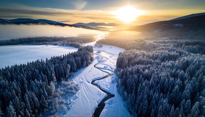 Winter River Flowing Through Snowy Forest at Sunrise Aerial View