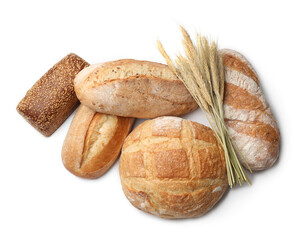 Different types of bread and wheat spikes isolated on white, top view