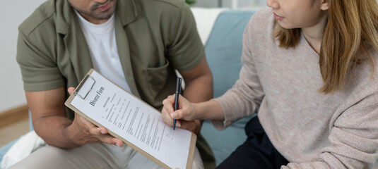 Divorce. Wife review and sign Divorce form. Couples desperate and disappointed after marriage. wife...