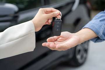 lease, rental car, sell, buy. Dealership manager send car keys to the new owner.  Sales, loan credit financial, rent vehicle, insurance,  renting, Seller, dealer, installment, car care business