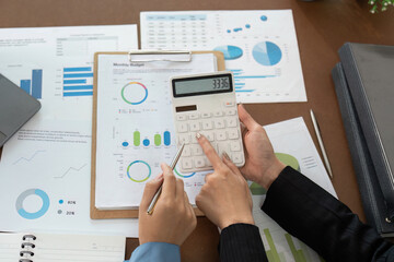 Financial advisor calculating monthly budget with client