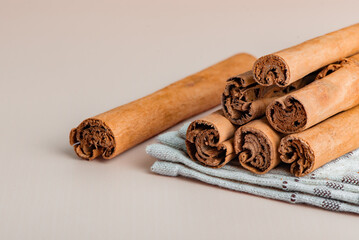 Ceylon cinnamon sticks and ground cinnamon powder on table aromatic spice with ayurvedic health benefits antioxidants and natural flavor.