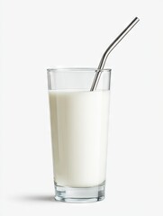 A tall glass of milk, nearly full, with a slender, silver metal straw inserted at a slight angle.  The background is pure white