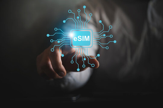 A person pointing at a glowing digital eSIM icon with circuit connections, symbolizing embedded SIM technology, mobile connectivity, eSIM Technology and Digital Connectivity Concept.
