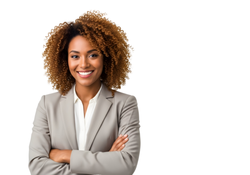 Smiling young African American businesswoman confidently stands with arms crossed, exuding professionalism and leadership, ready to blend ideas and drive dynamic success.