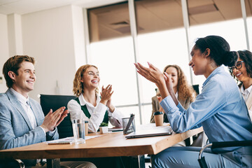 Business professionals engaged in a collaborative meeting at a modern office, highlighting teamwork and professional interaction