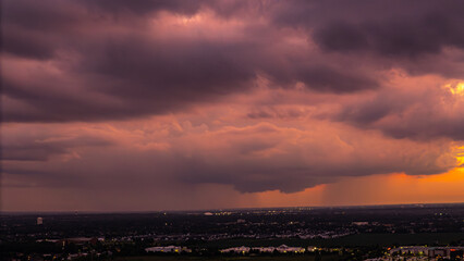 colorful dramatic sky with golden purple clouds at sunset