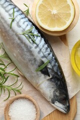 Fresh raw mackerel and spices on table, flat lay. Seafood delicacies