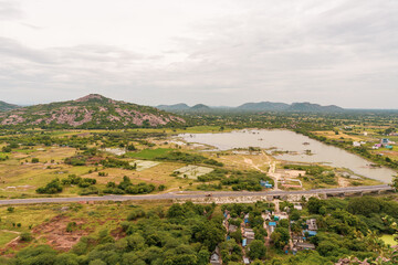 A view of a rural area with a road and a lake