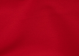 Fototapeta premium Textured red fabric close-up, ribbed textile sample