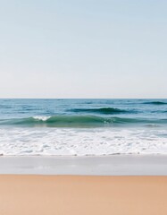 Fototapeta premium Serene beach golden sand foamy waves