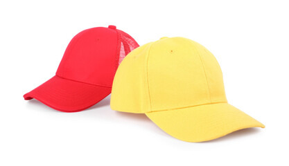 Red and yellow baseball caps isolated on white. Mockup for design