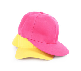 Pink and yellow baseball caps isolated on white. Mockup for design