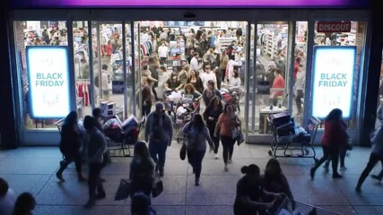 Excited Shoppers Rush into Retail Store for Black Friday Savings Event Celebration
