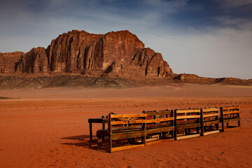 Desert Wadi Rum at sunrise, in Jordan with a bench in the foreground